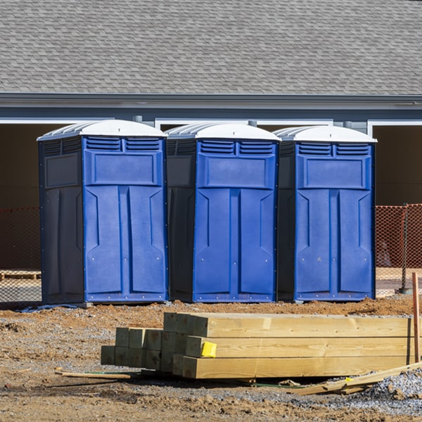 what is the cost difference between standard and deluxe portable restroom rentals in Moorland Michigan